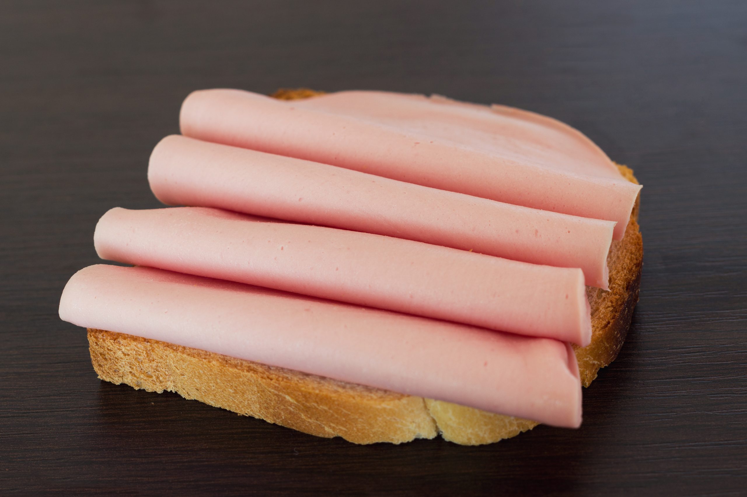 Salami sandwich. Open sandwich of salami slices on bread.
